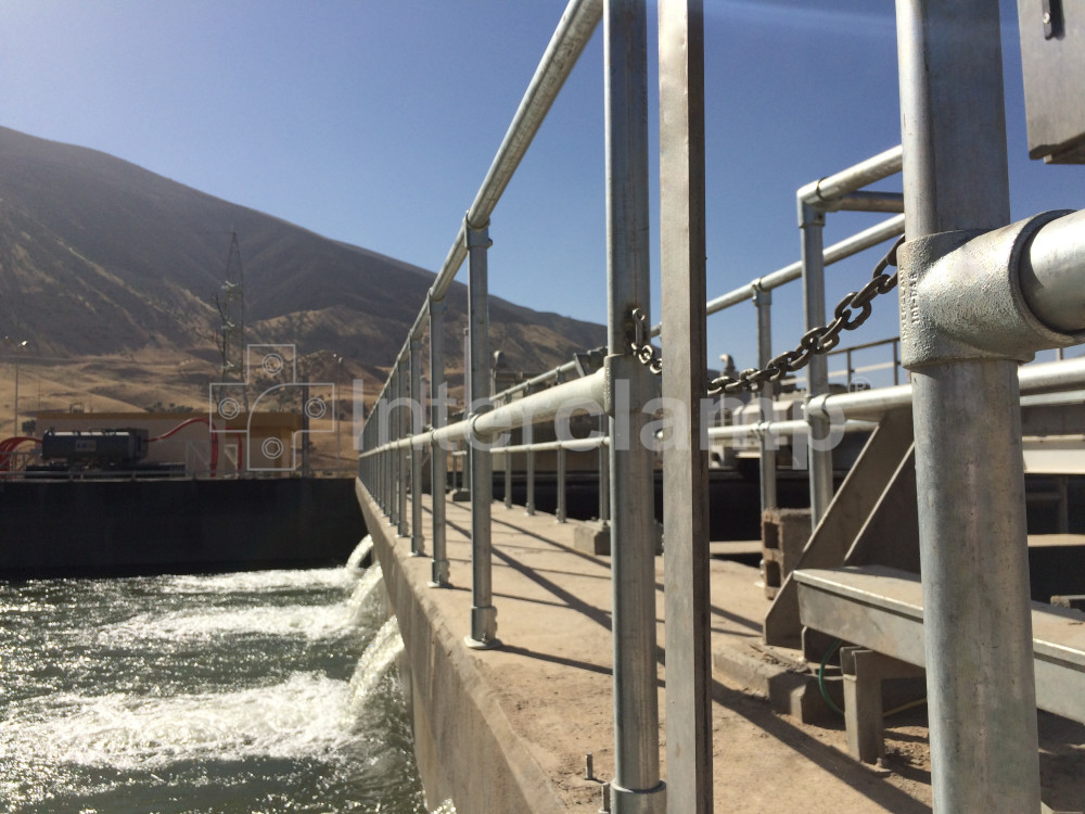 Water treatment works in Kurdistan featuring safety handrails and balustrades made with Interclamp key clamp fittings, enhancing safety measures for the staff.